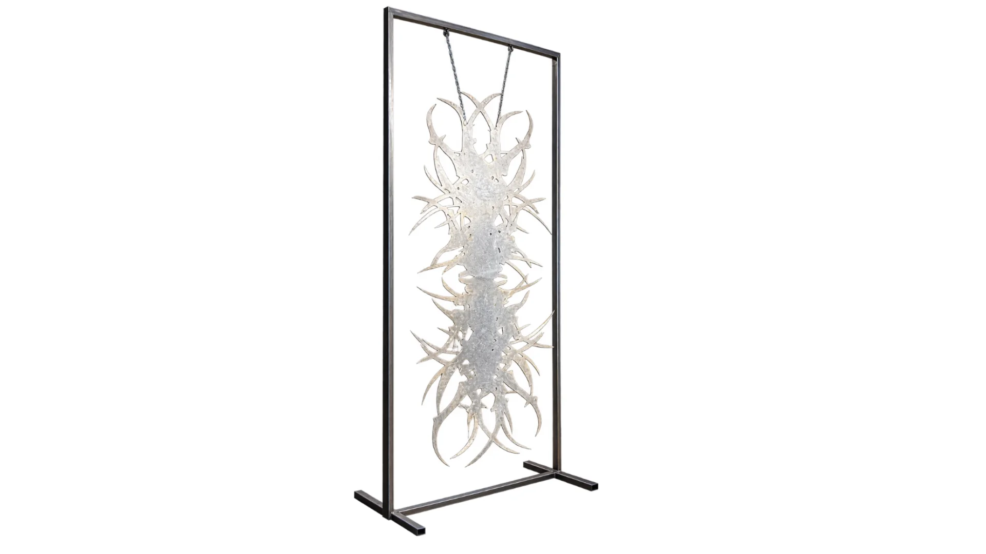 Vertical rectangular steel frame holding an elongated, branching abstract metal sculpture against a white background.