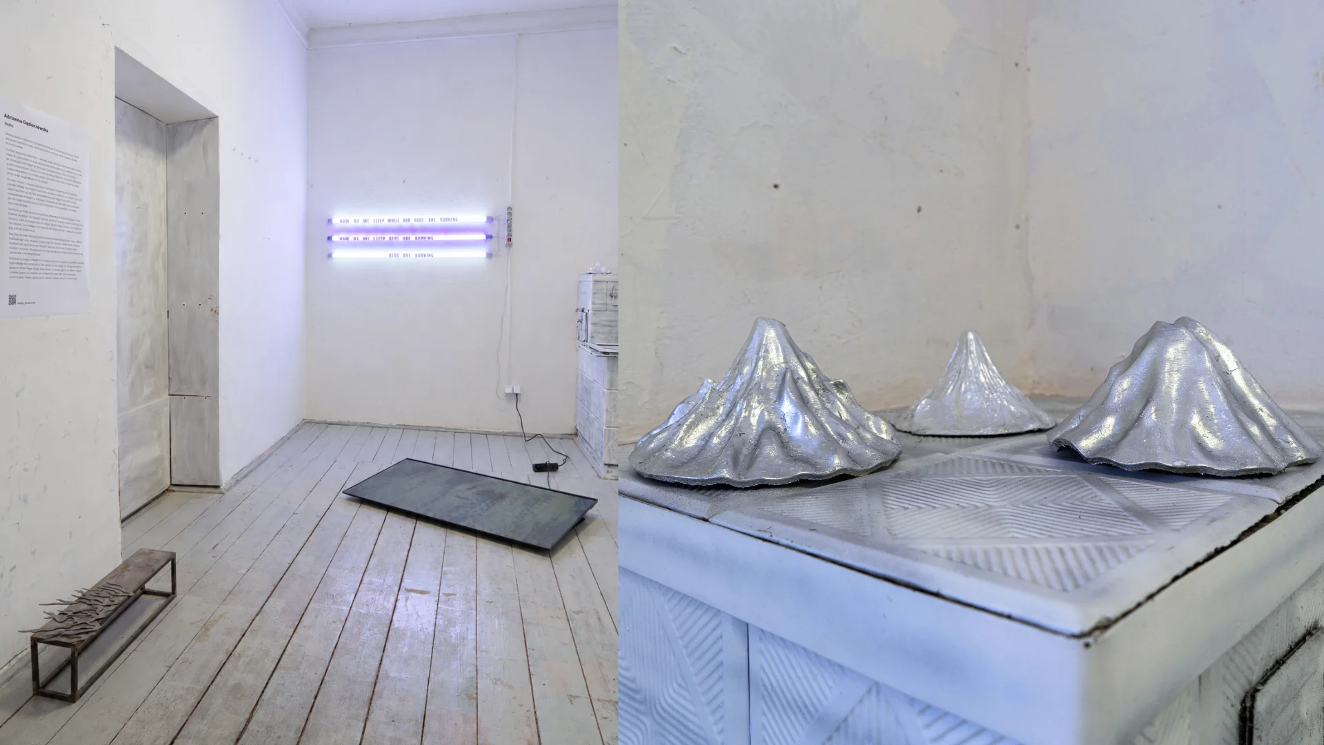 Multimedia installation HAŁDA featuring glowing fluorescent tubes, silver sculptural forms and a video screen in a white gallery.
