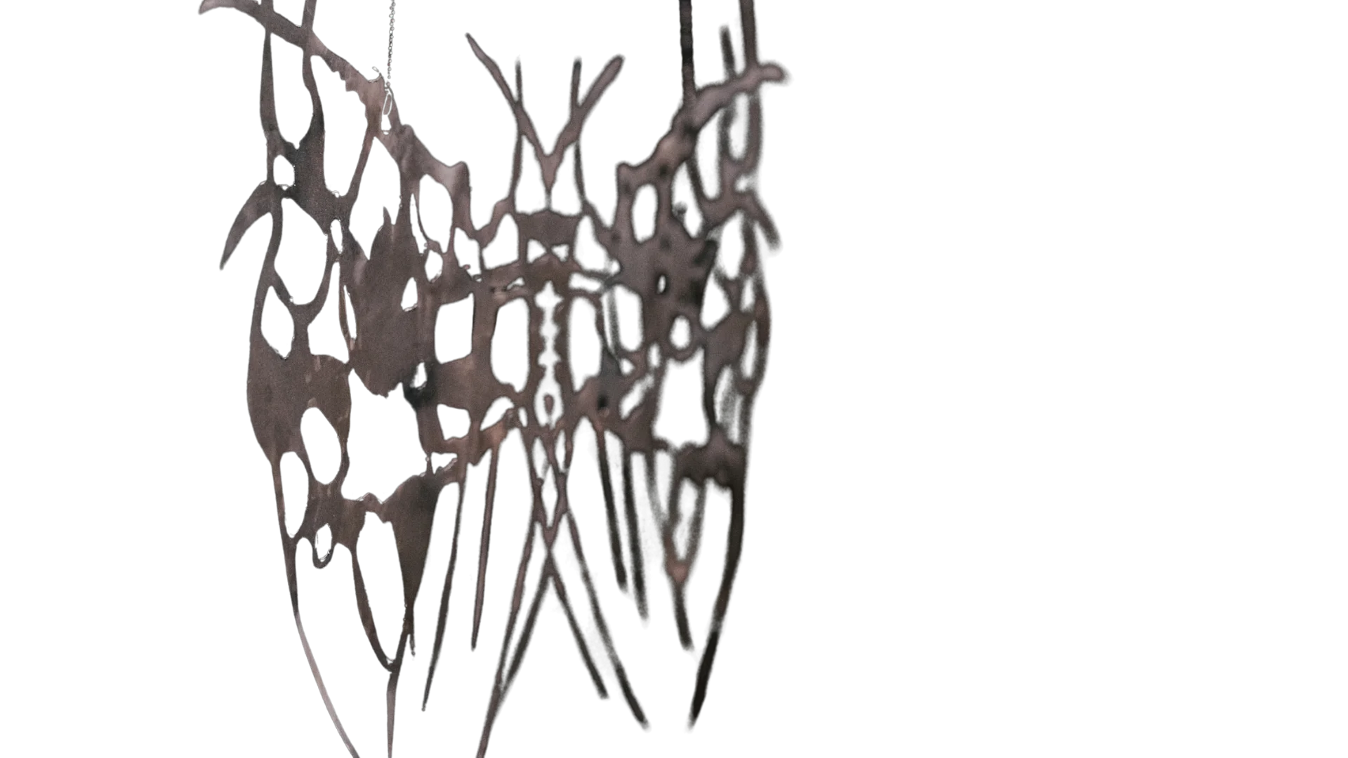Intricate abstract steel sculpture with interconnected branching forms and sharp organic extensions.