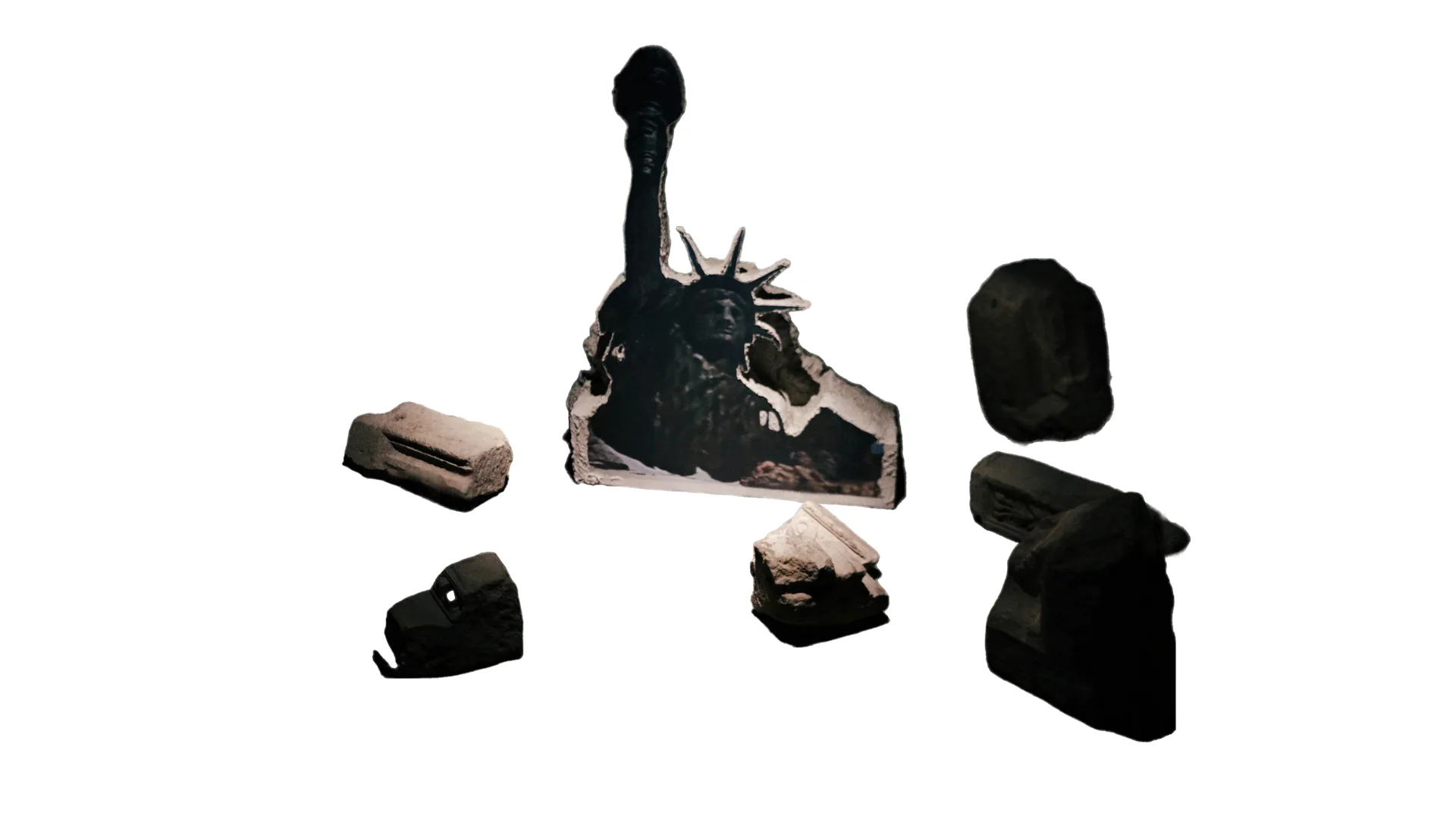 Isolated sculpture of a damaged Statue of Liberty surrounded by fragments of architectural ruins.